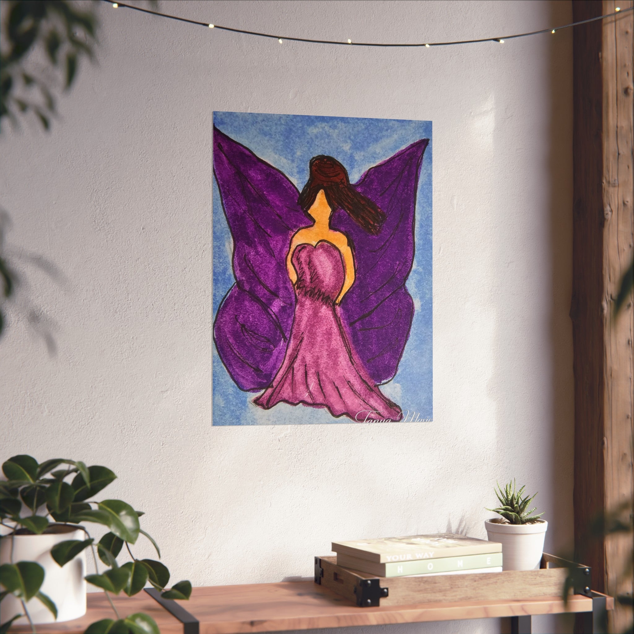 Purple wings angel wall art print with a pink dress and heart shape, shown on a wall