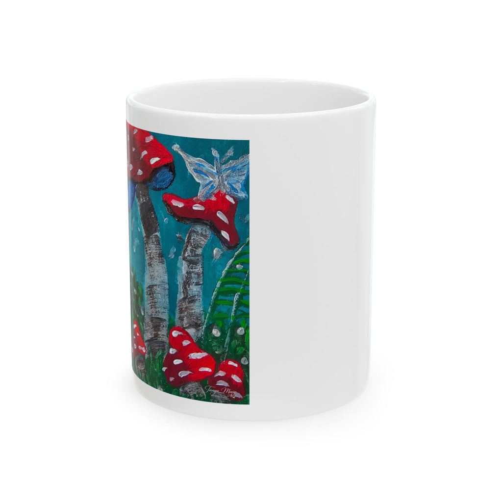 White ceramic mug with vertical red mushroom and tree artwork on side