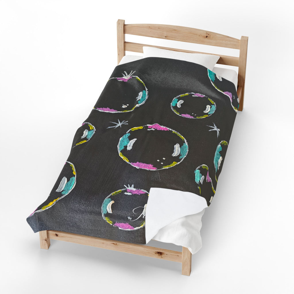 Black velveteen plush blanket with colorful bubble ring and star pattern