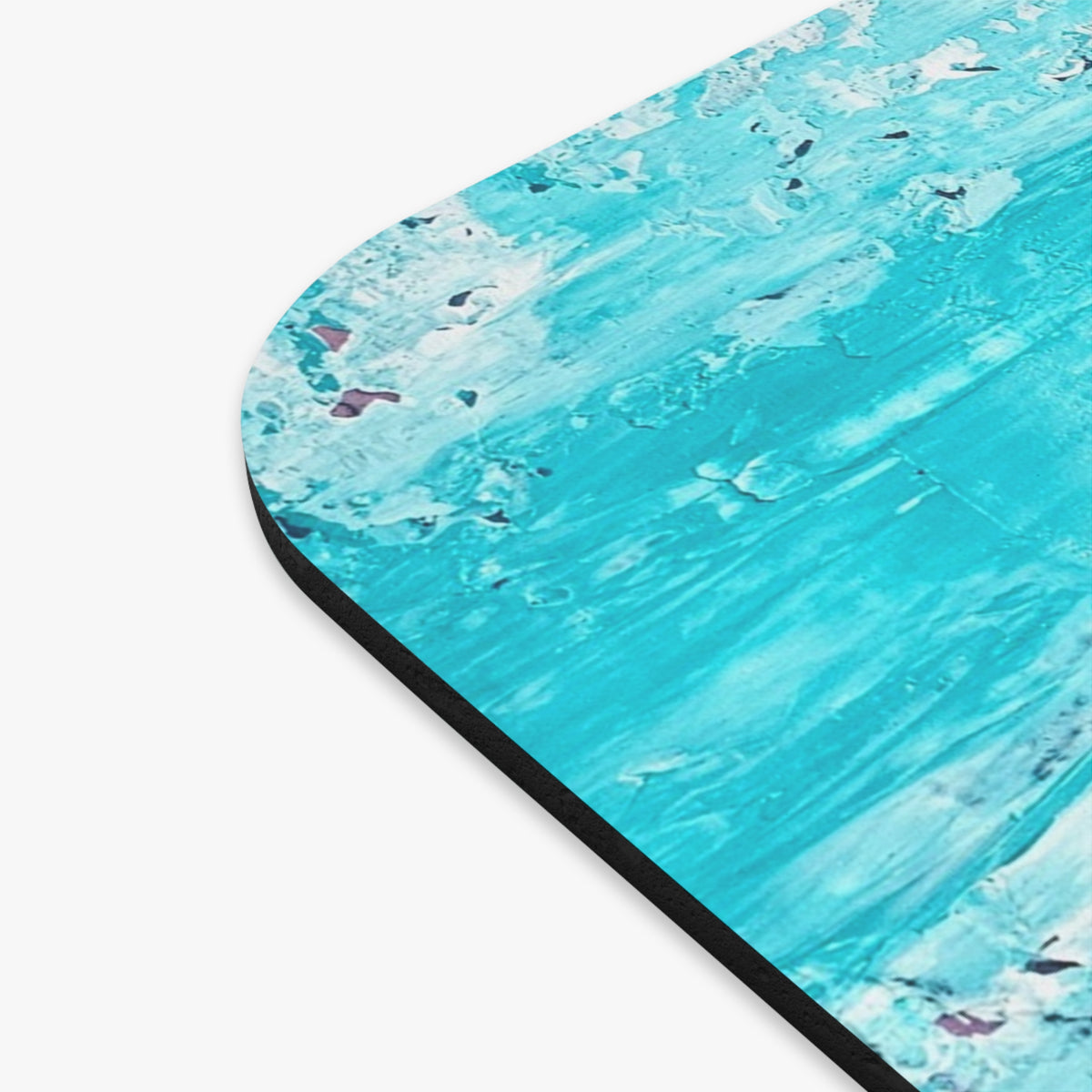 Turquoise rectangular mouse pad with rounded edge, black underside, abstract texture
