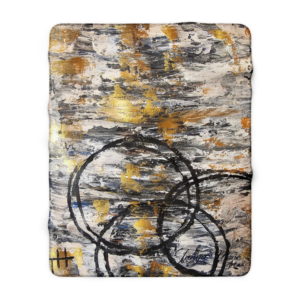Abstract sherpa blanket with textured gold accents and bold charcoal circular scribbles
