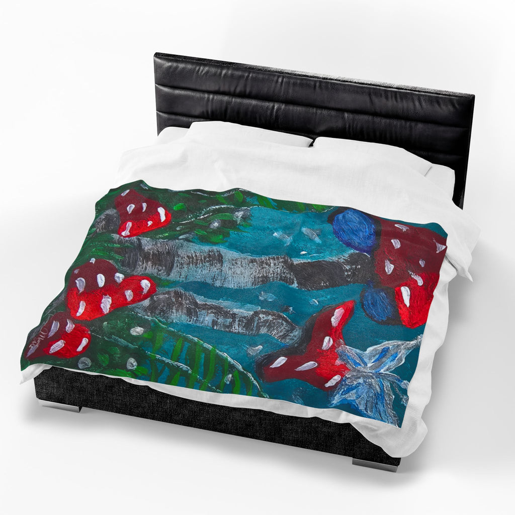 Velveteen plush throw blanket on black bed, red mushroom caps over teal and green forest art