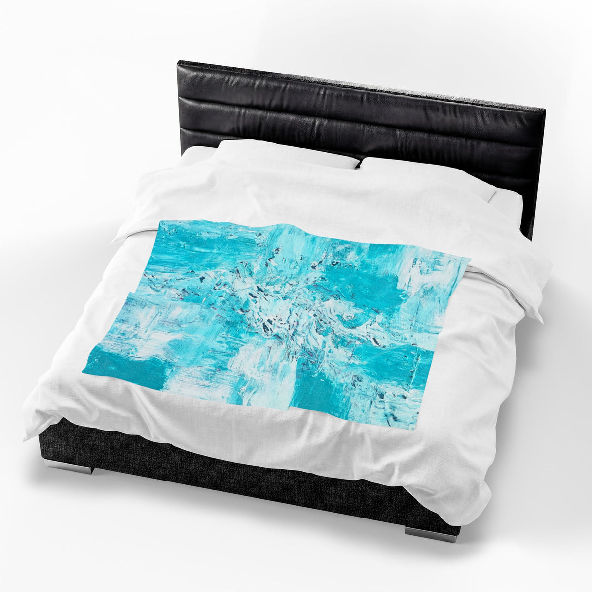 Velveteen plush blanket on dark bed with turquoise abstract rectangle center panel