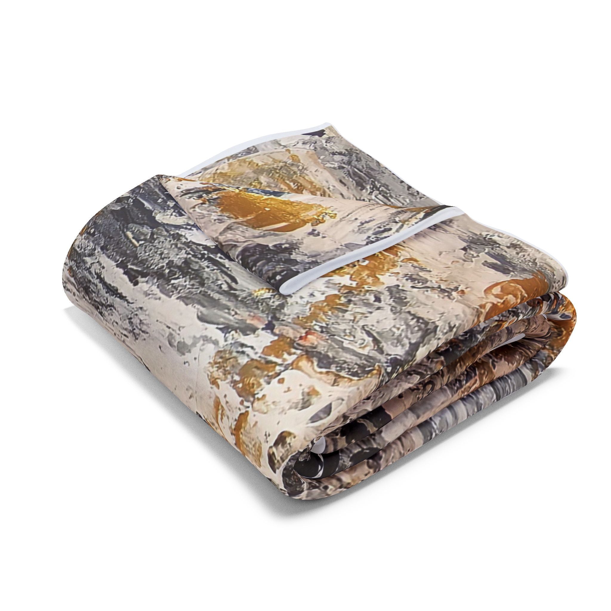 Folded fleece throw blanket with abstract grey, white, black, and gold pattern