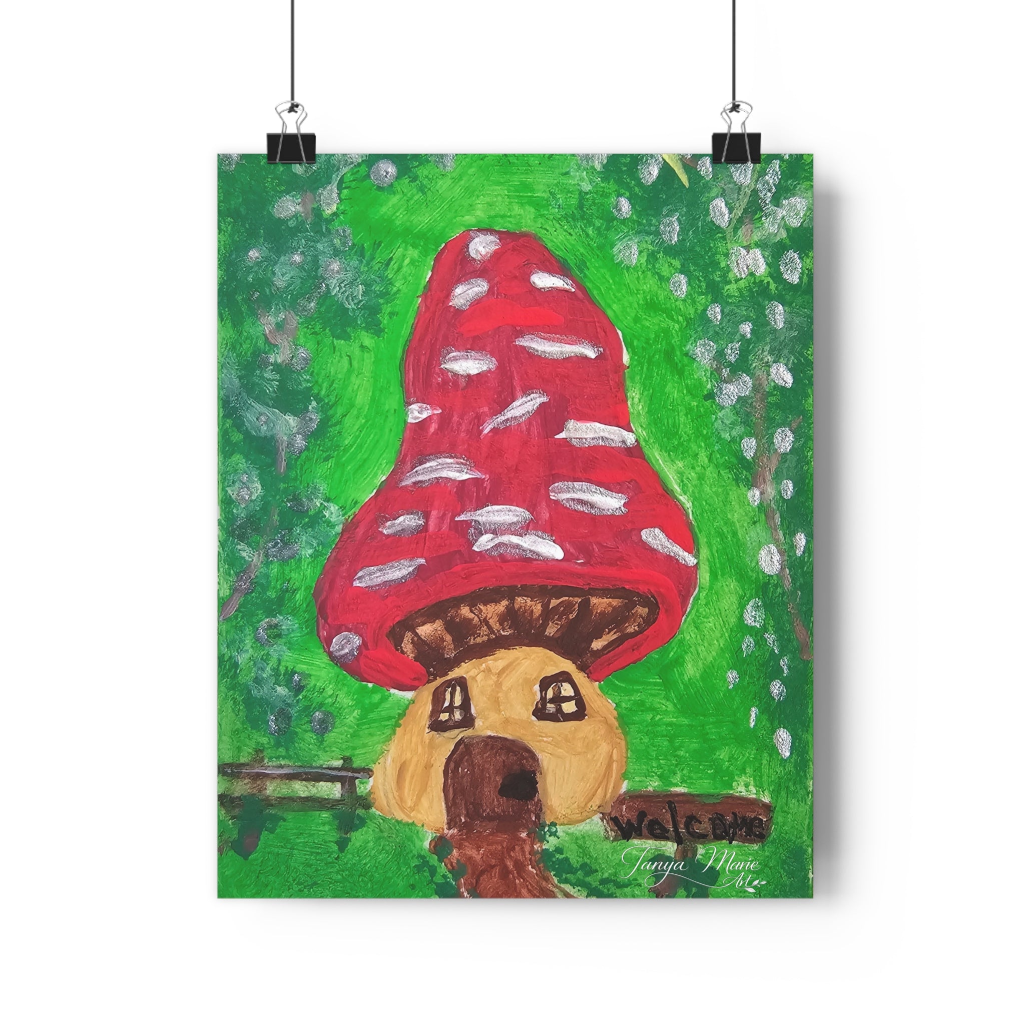 Wall art print showing a red mushroom house with white spots above a brown dog