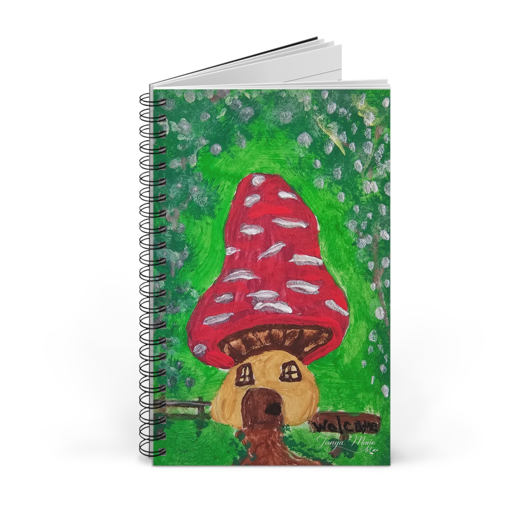 Spiral journal front cover with red mushroom over green field illustration