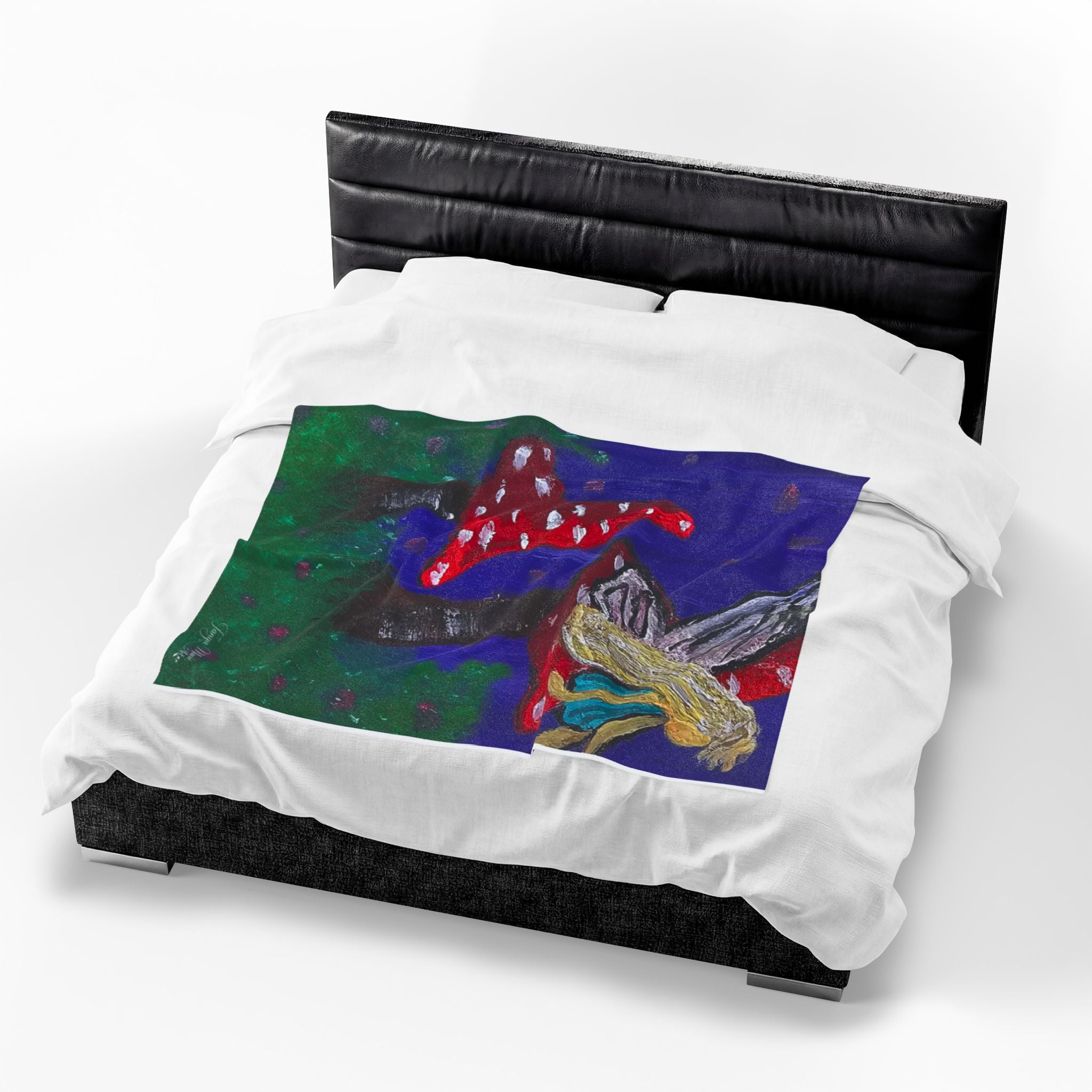 Velveteen blanket plush throw on dark bed, blue artwork with fairy and red toadstools