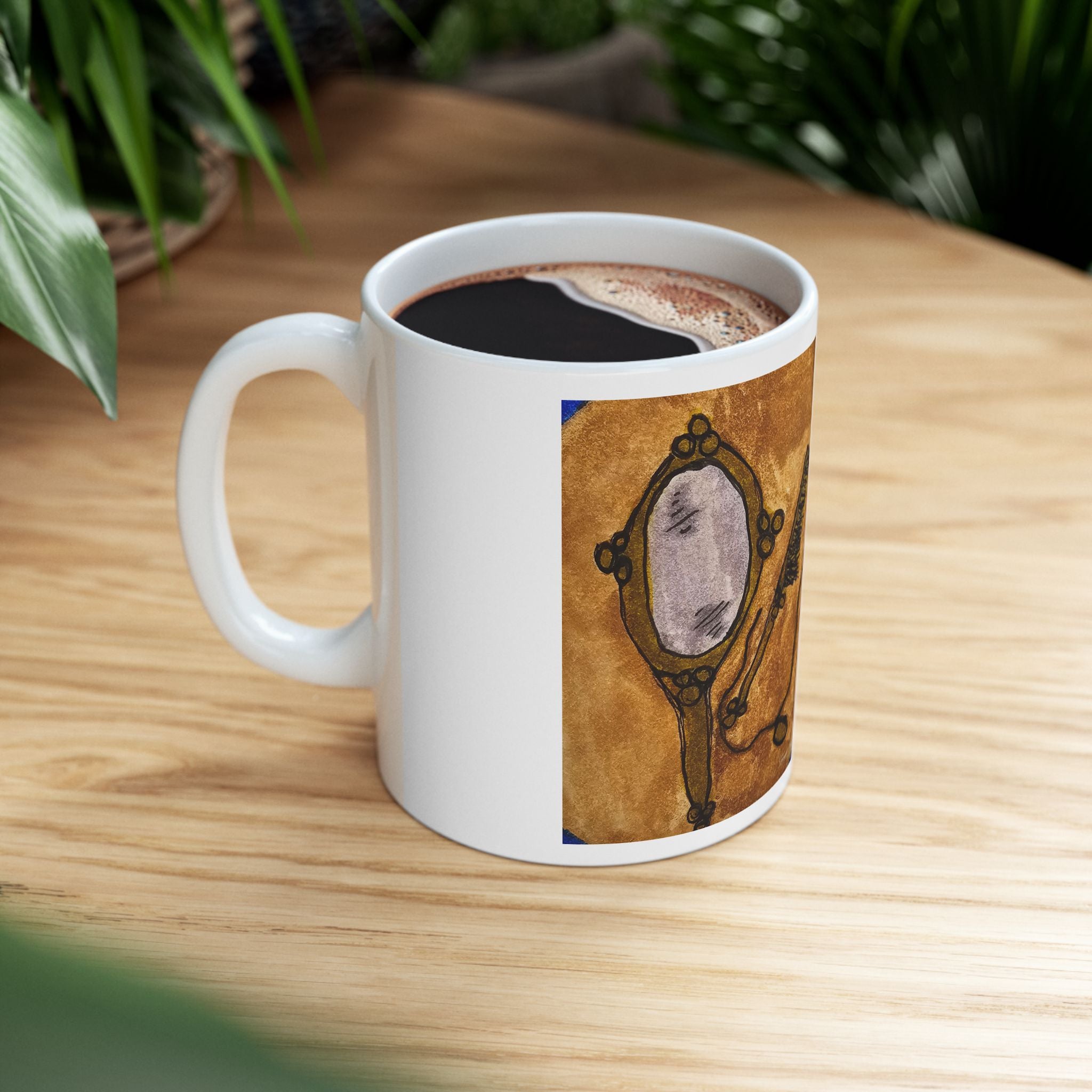 Ceramic coffee mug with vanity mirror artwork, filled with coffee