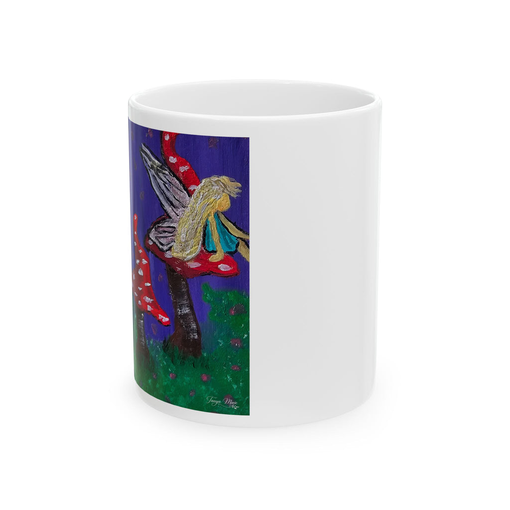 White ceramic mug with wraparound fairy and red toadstool artwork