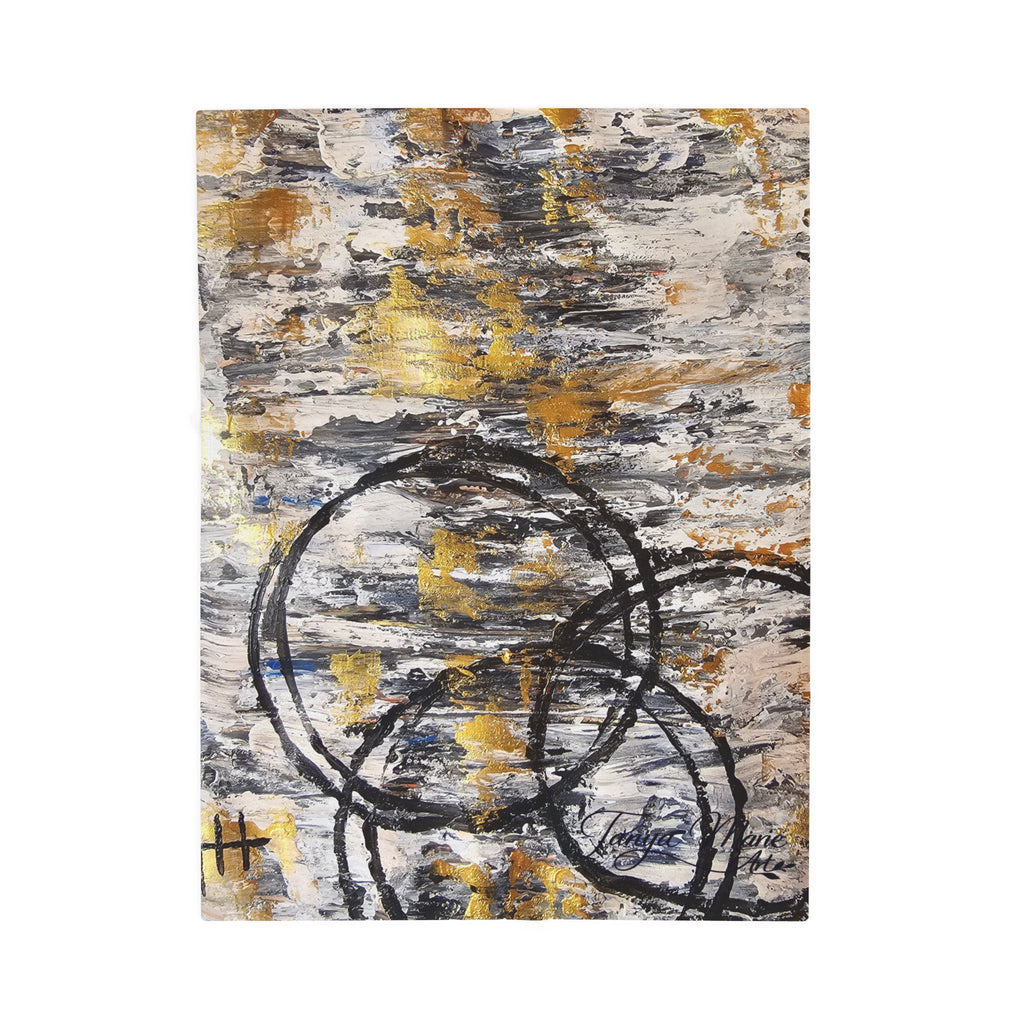 Abstract plush blanket with centered charcoal circle lines and speckled gold accents on gray