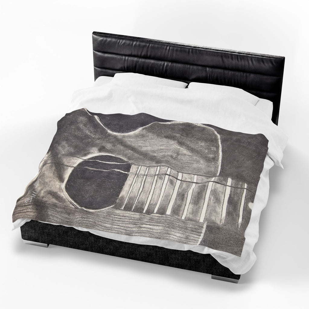Velveteen plush blanket on bed, gray acoustic guitar sketch with white string details