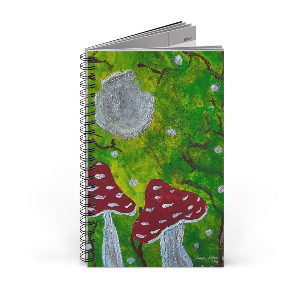 Stacked spiral nature journals with green illustrated covers and red mushroom artwork