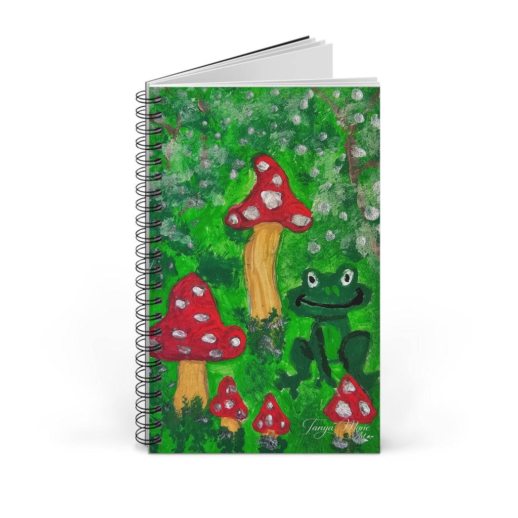 Spiral journal front cover with green forest artwork, red mushrooms, and a frog.