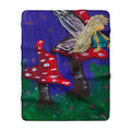 Sherpa fleece throw blanket, red mushrooms beside tall fairy tree on purple blue and green