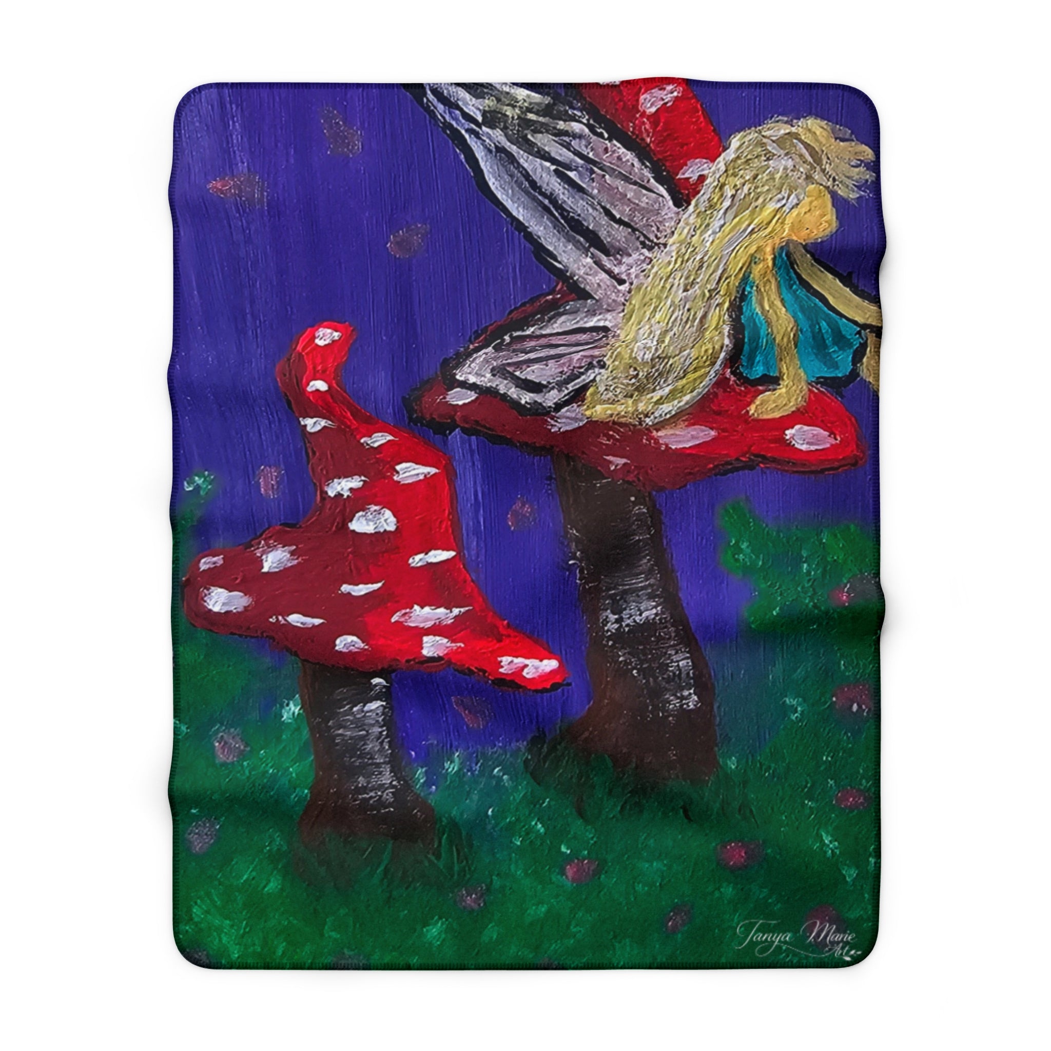Sherpa fleece throw blanket, red mushrooms beside tall fairy tree on purple blue and green