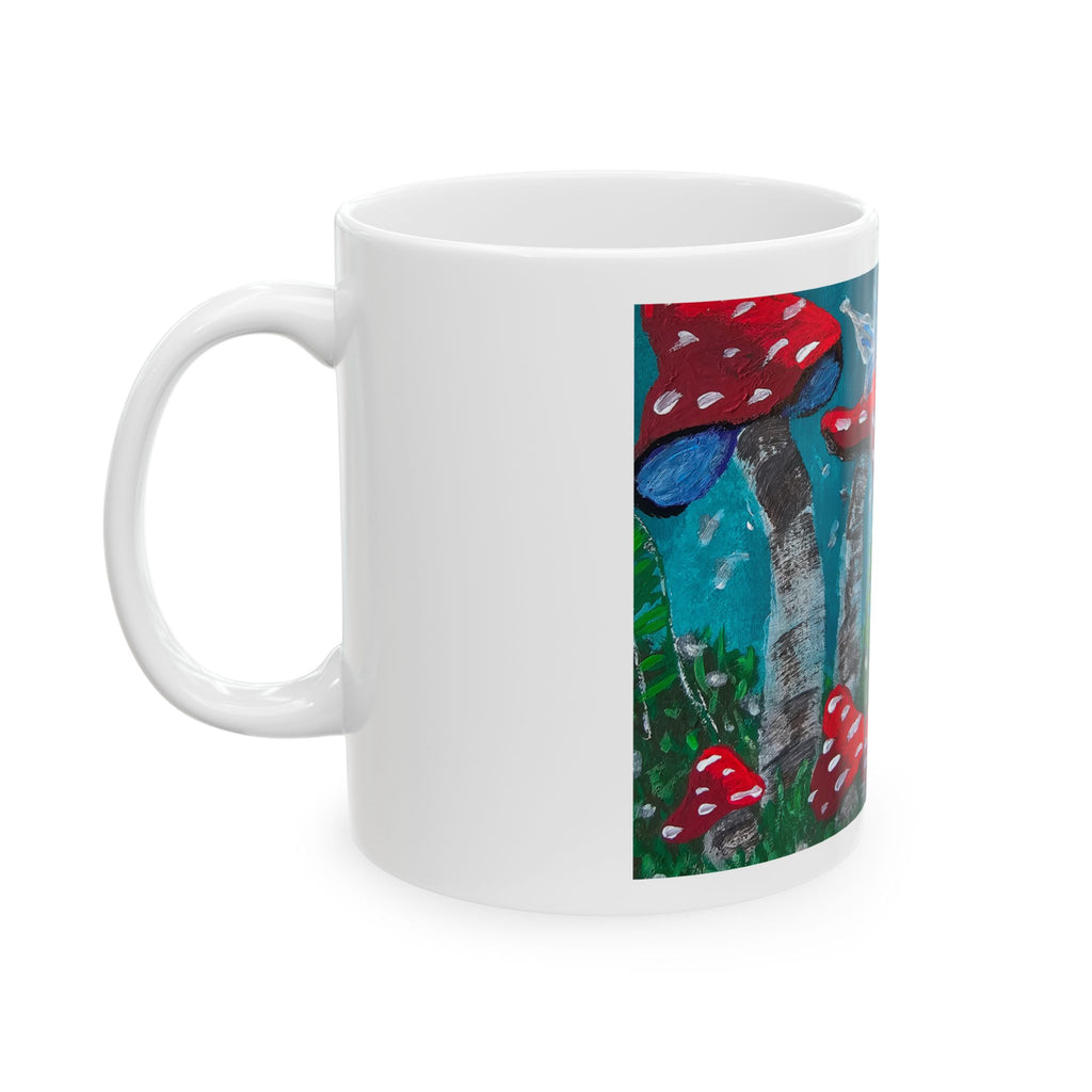 White ceramic mug with red mushroom garden artwork panel and left handle