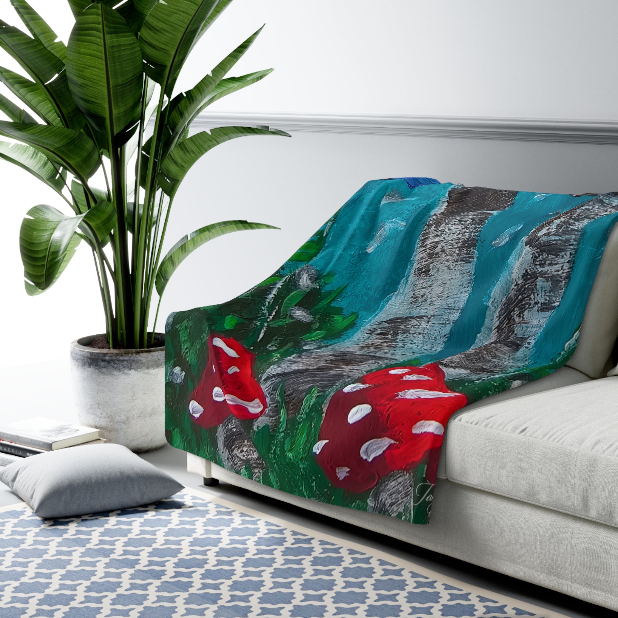 Sherpa blanket with red toadstool and blue-green mushroom print, plush fleece.