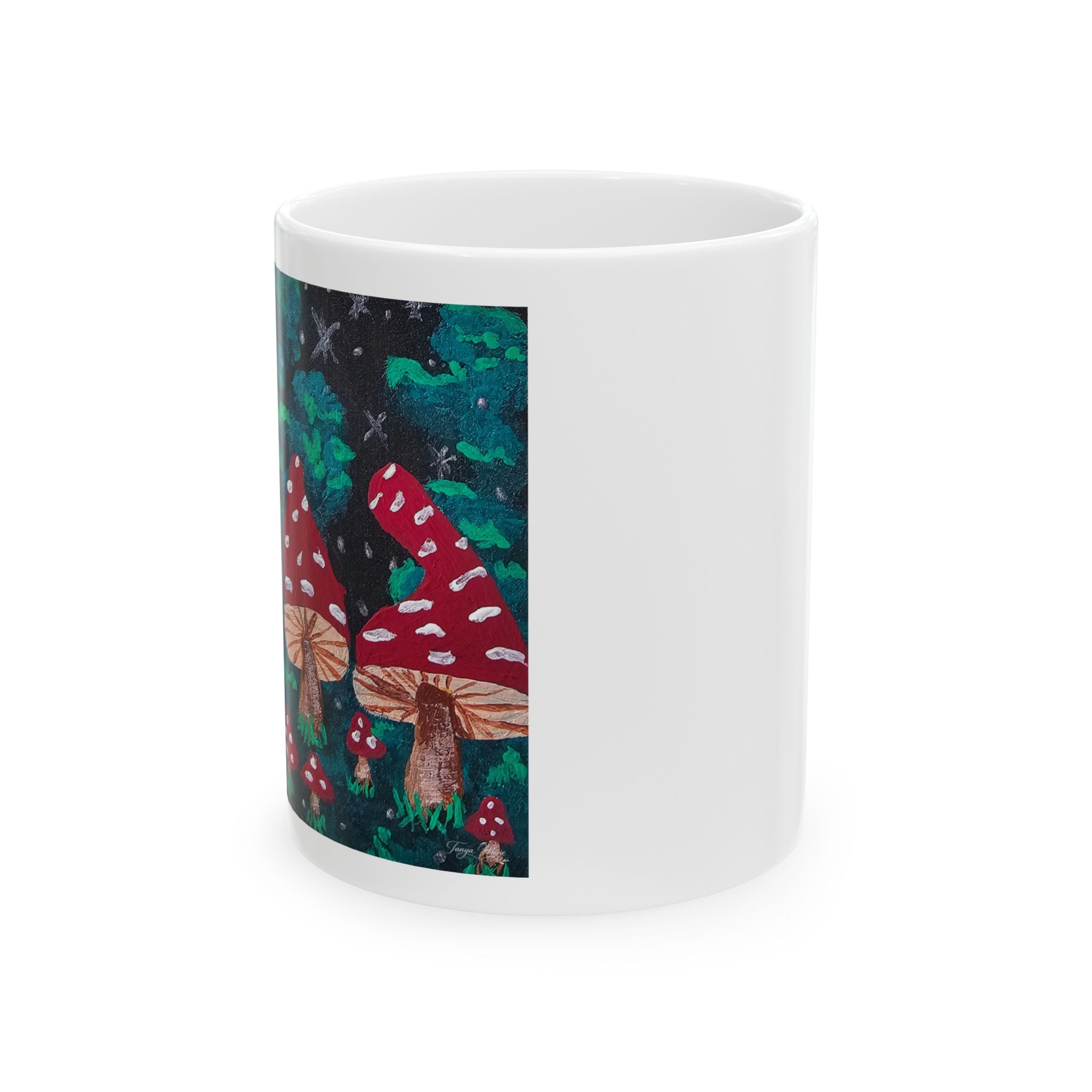 White ceramic mug with side panel showing red mushroom caps and green forest graphic