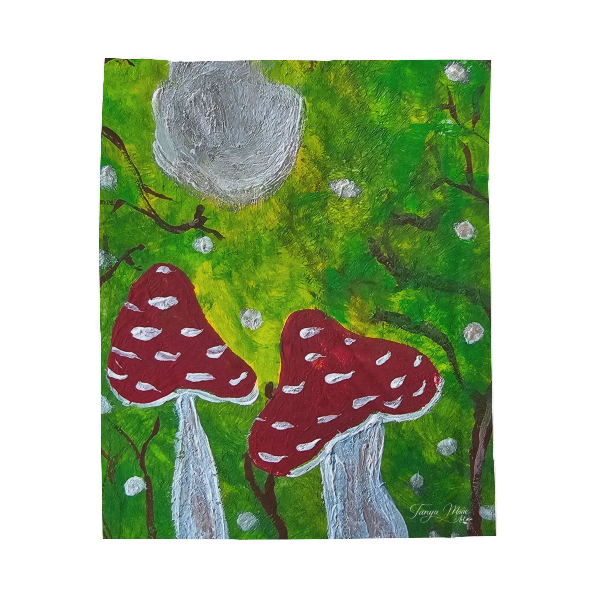 Close view of square blanket art: green forest with red mushroom caps and gray moon.