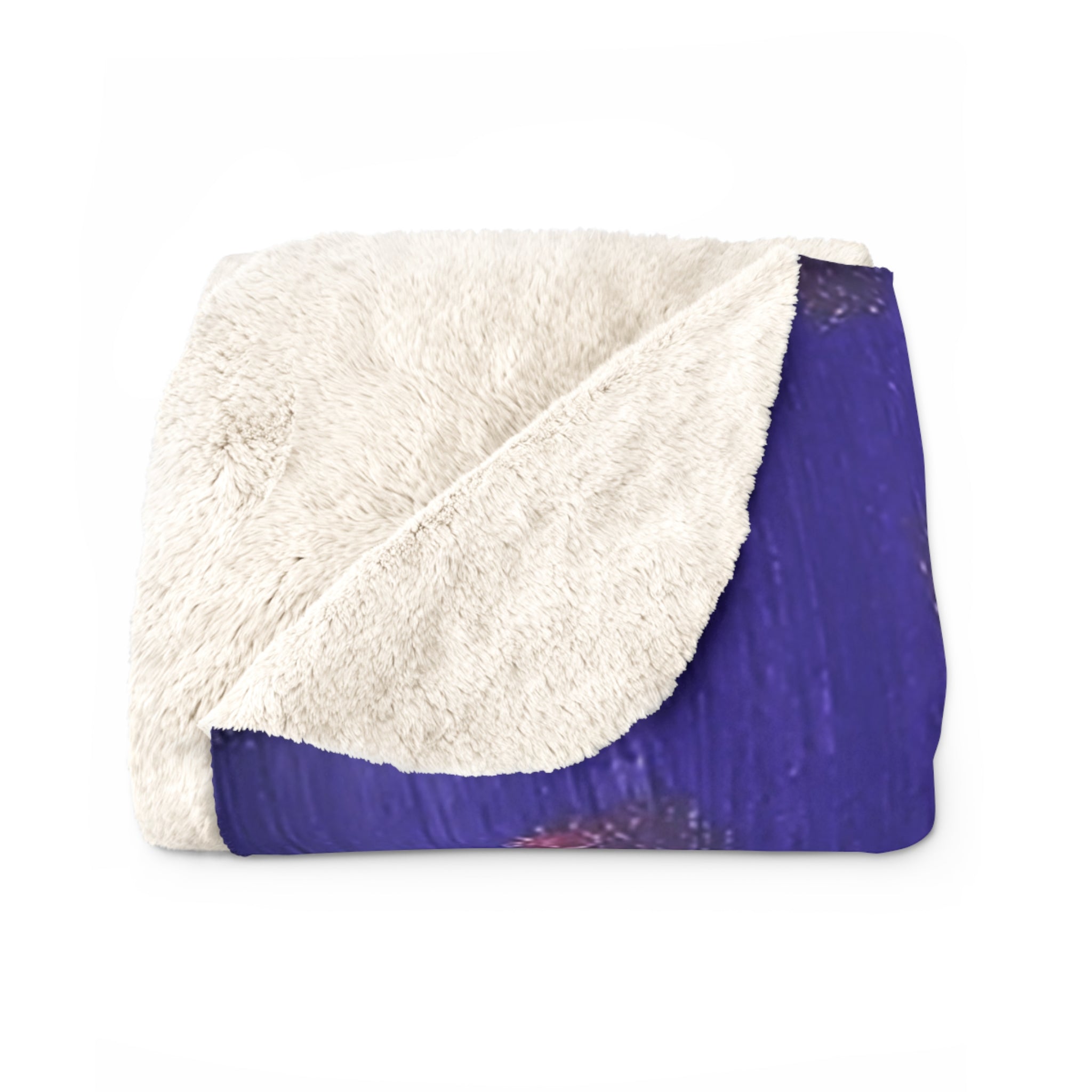 Sherpa blanket with white sherpa fleece and solid purple backing, folded