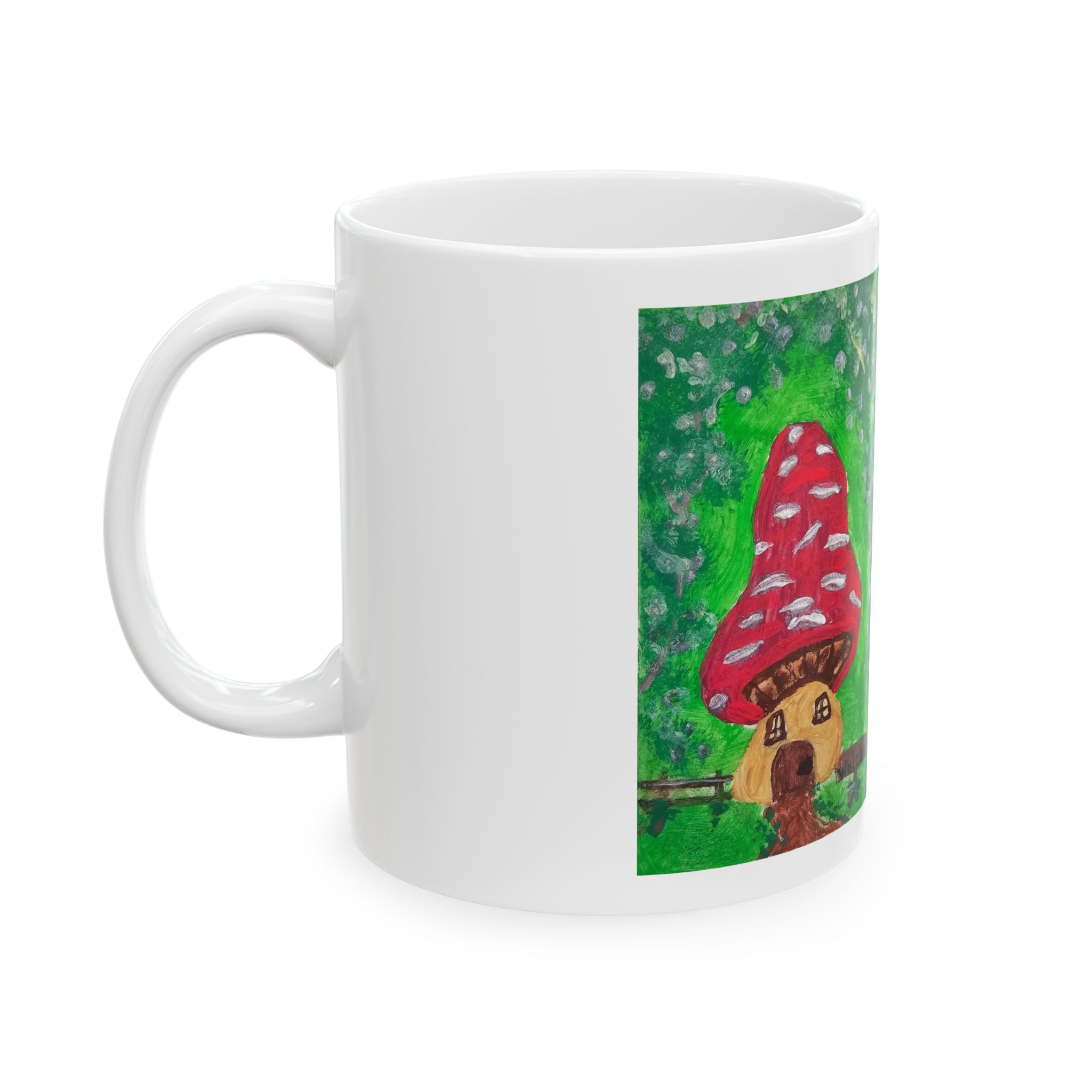 White ceramic mug with side handle and red mushroom house artwork on front