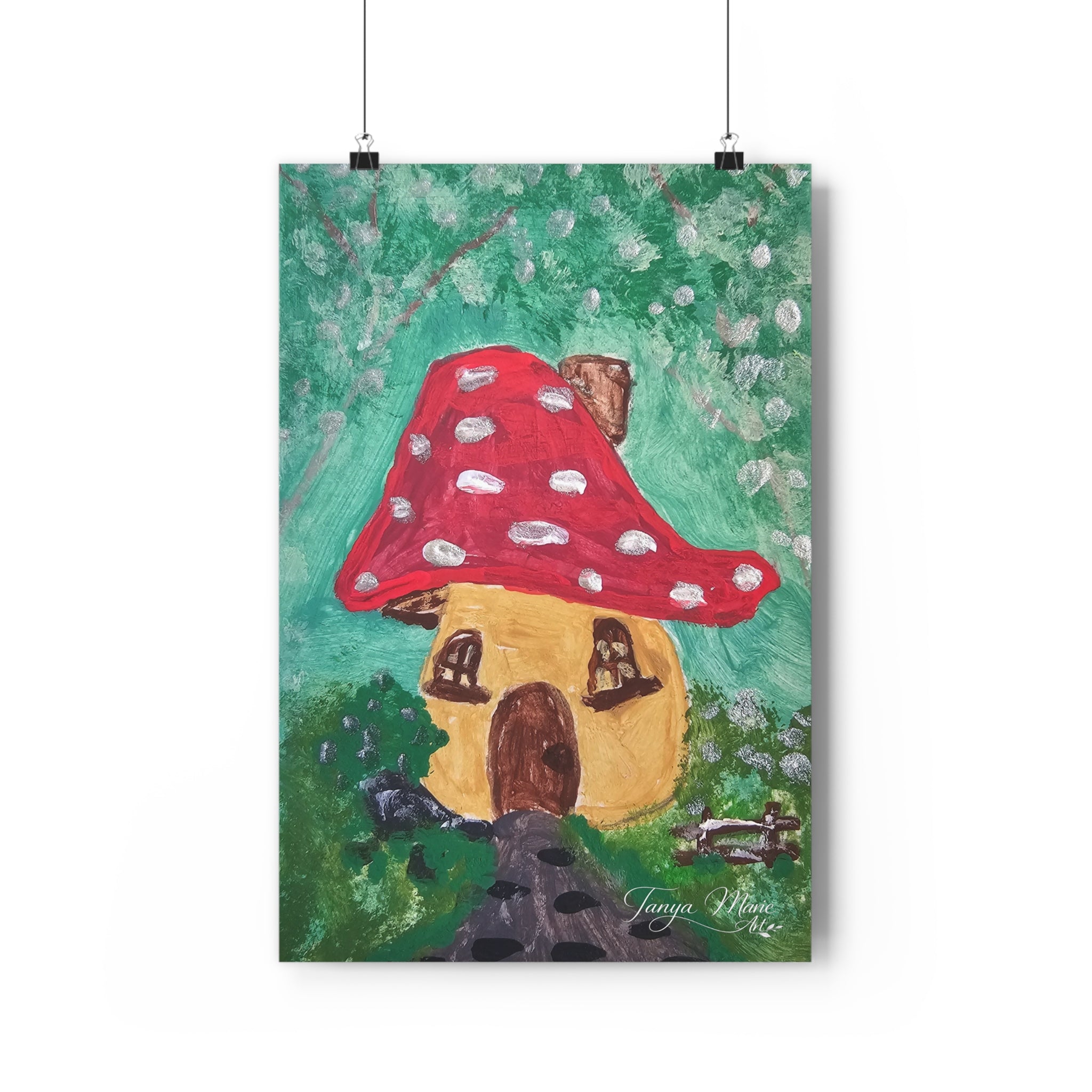 Mushroom cottage wall art print with red polka-dot mushroom roof, hanging on clips