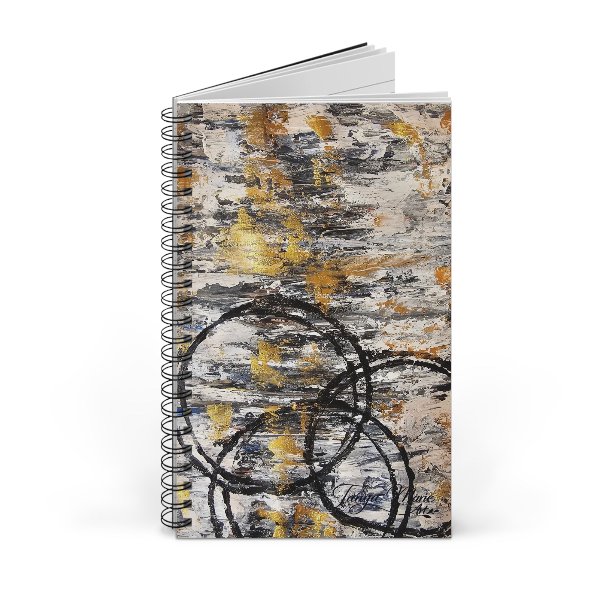 Spiral notebook front view with abstract gold and charcoal texture and black circular marks