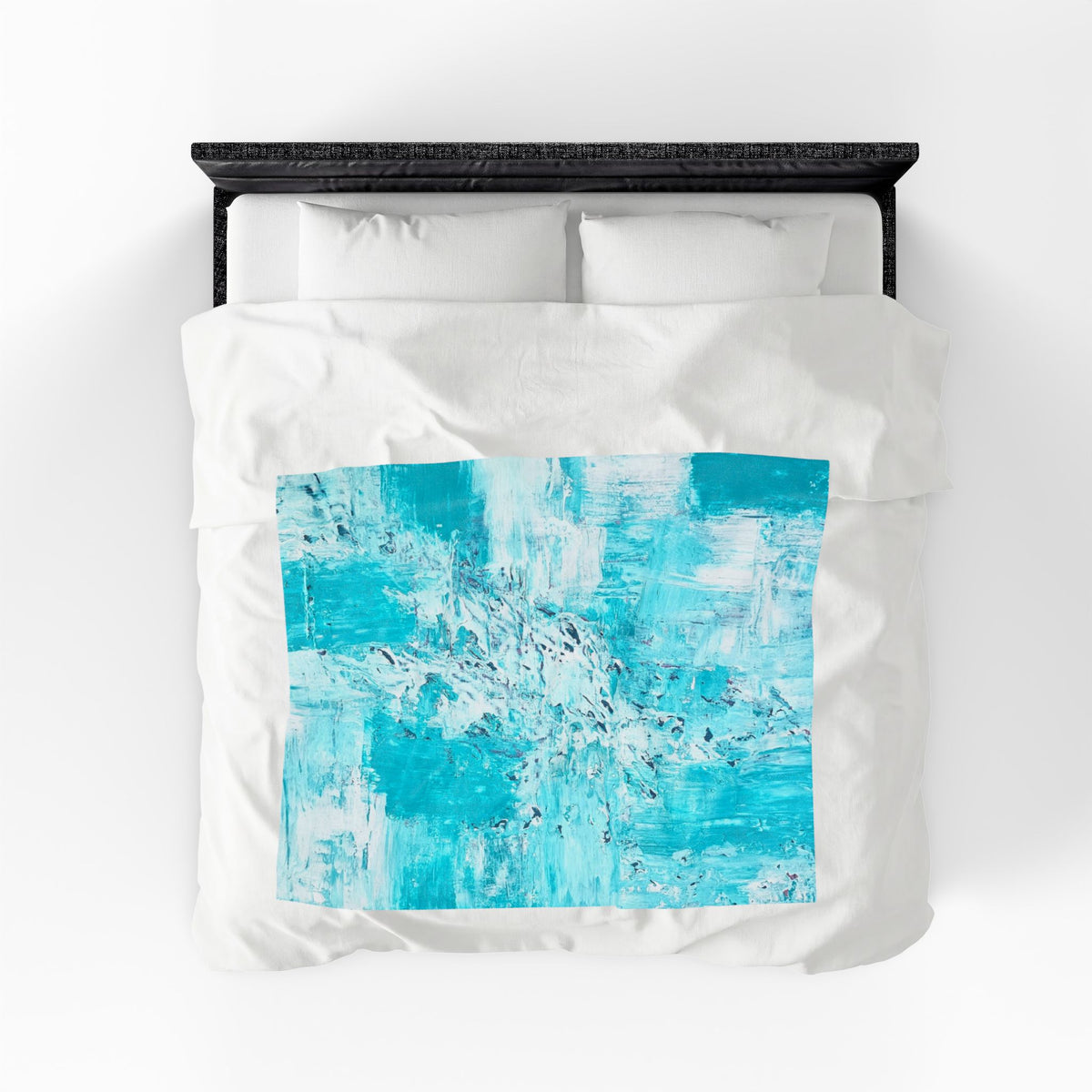 Velveteen plush blanket with turquoise abstract rectangle print on white bedding