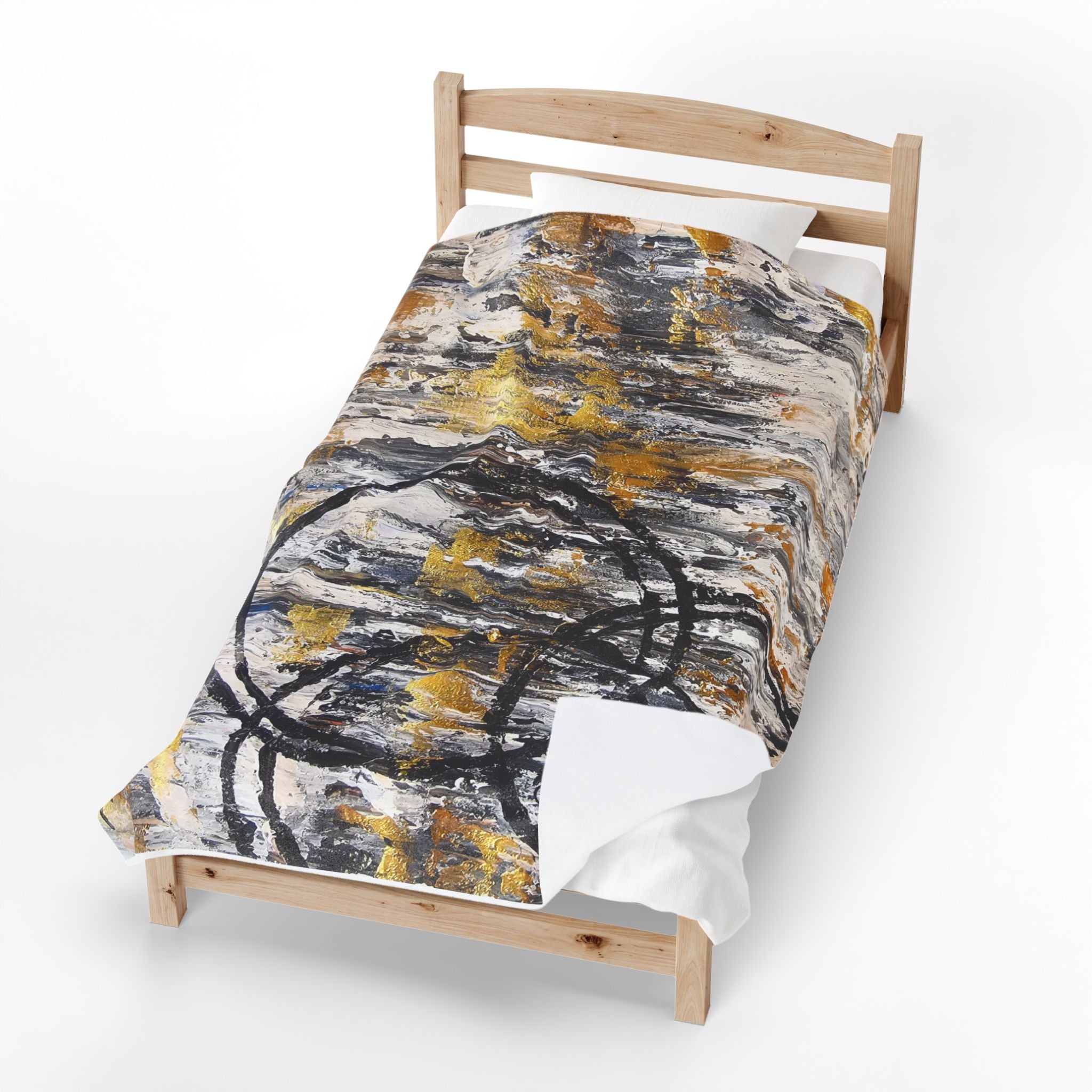 Velveteen plush blanket with abstract gold and charcoal circle design on white