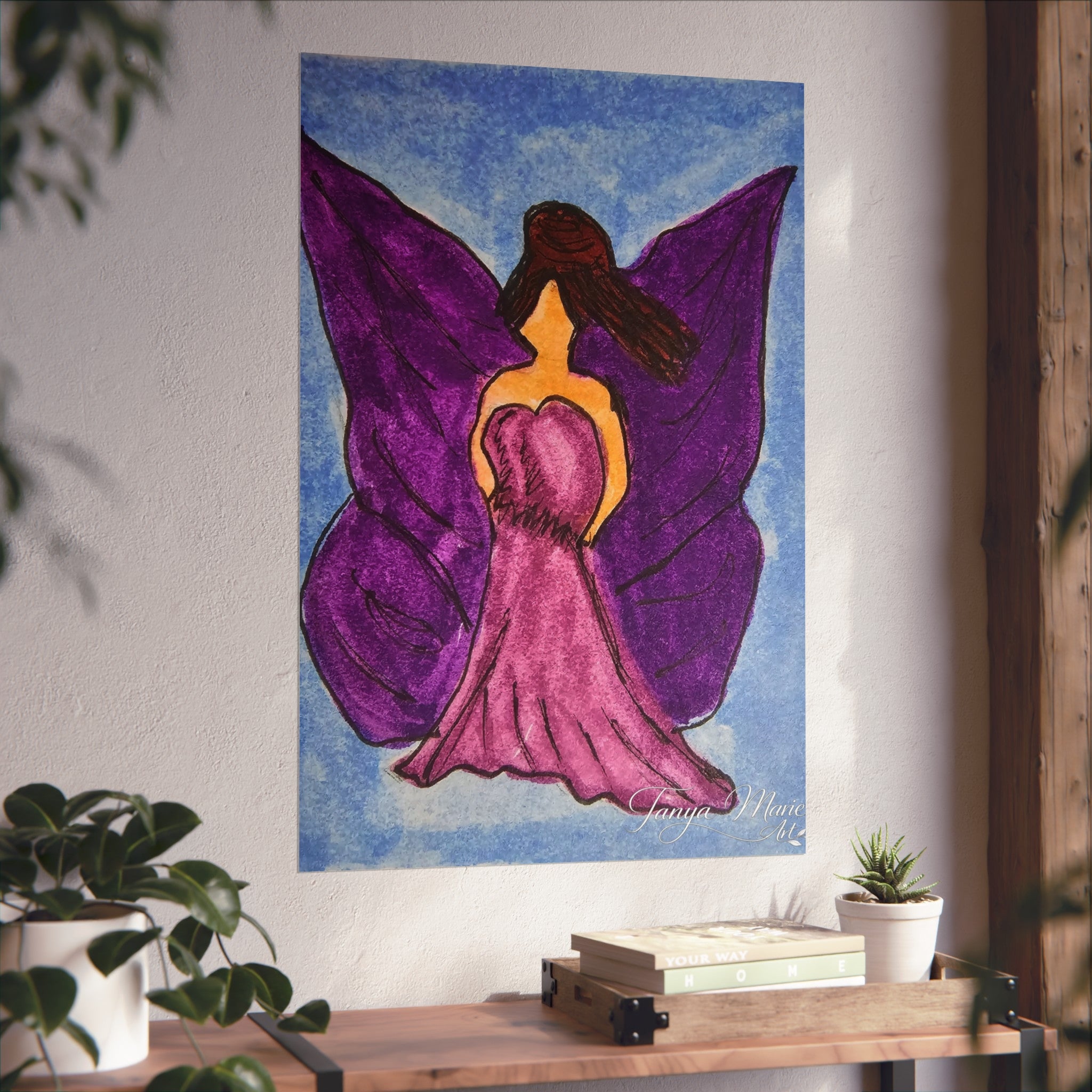 Purple wings angel wall art print on a wall with wooden frame door and shelf below