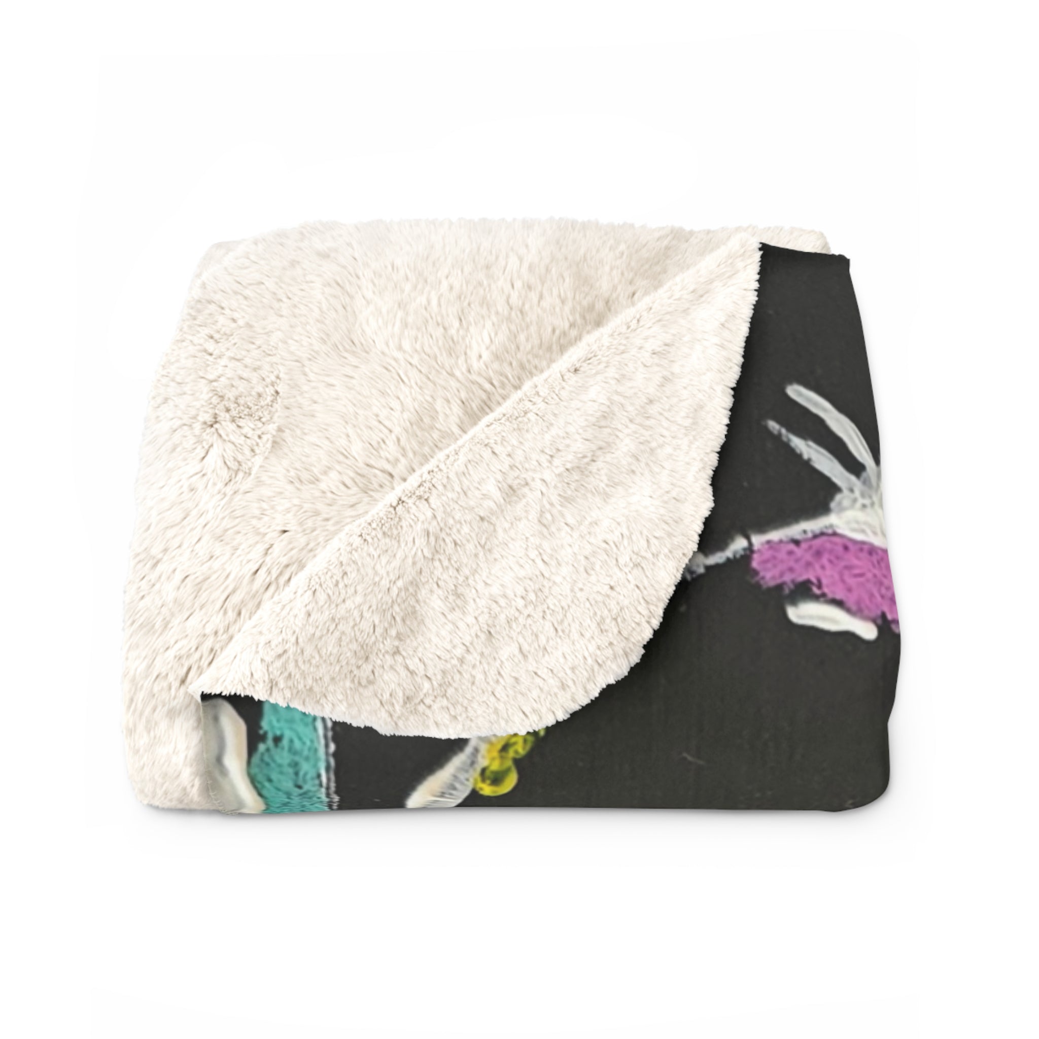 Sherpa fleece blanket folded, fluffy white sherpa side over dark gray bubble circle print