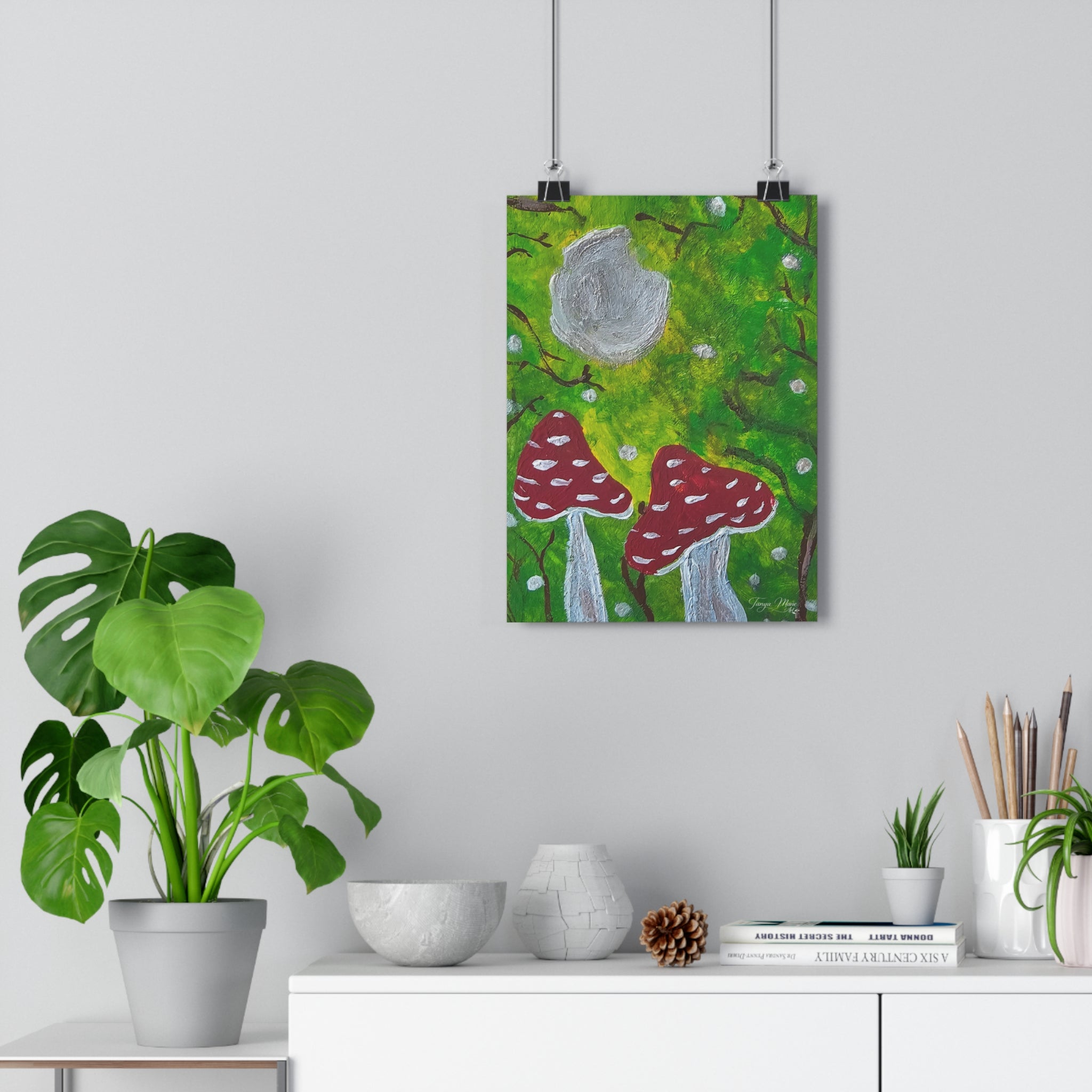 Whimsical forest wall art print with green background, gray moon circle, and red mushrooms