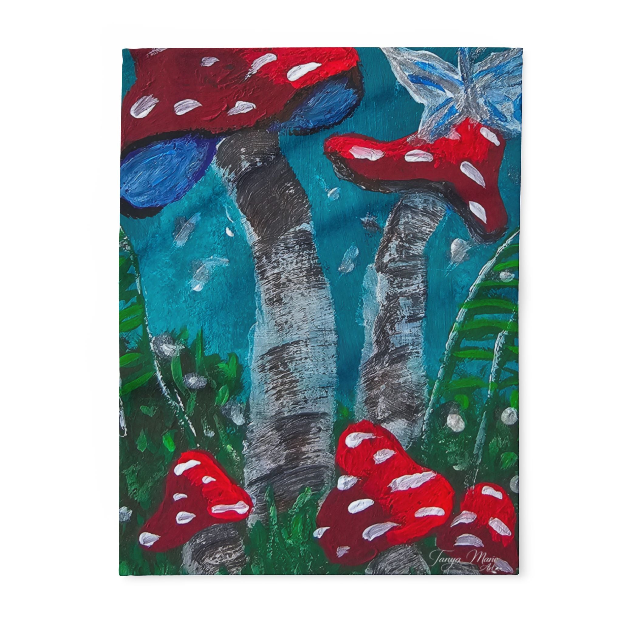 Fleece blanket with colorful mushroom forest artwork, red and blue mushrooms on teal trees