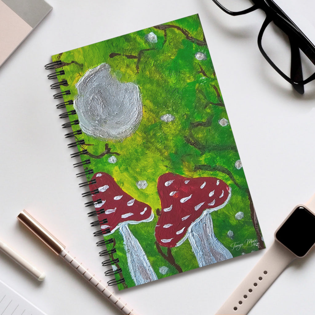Spiral nature journal with illustrated green cover and red mushroom artwork