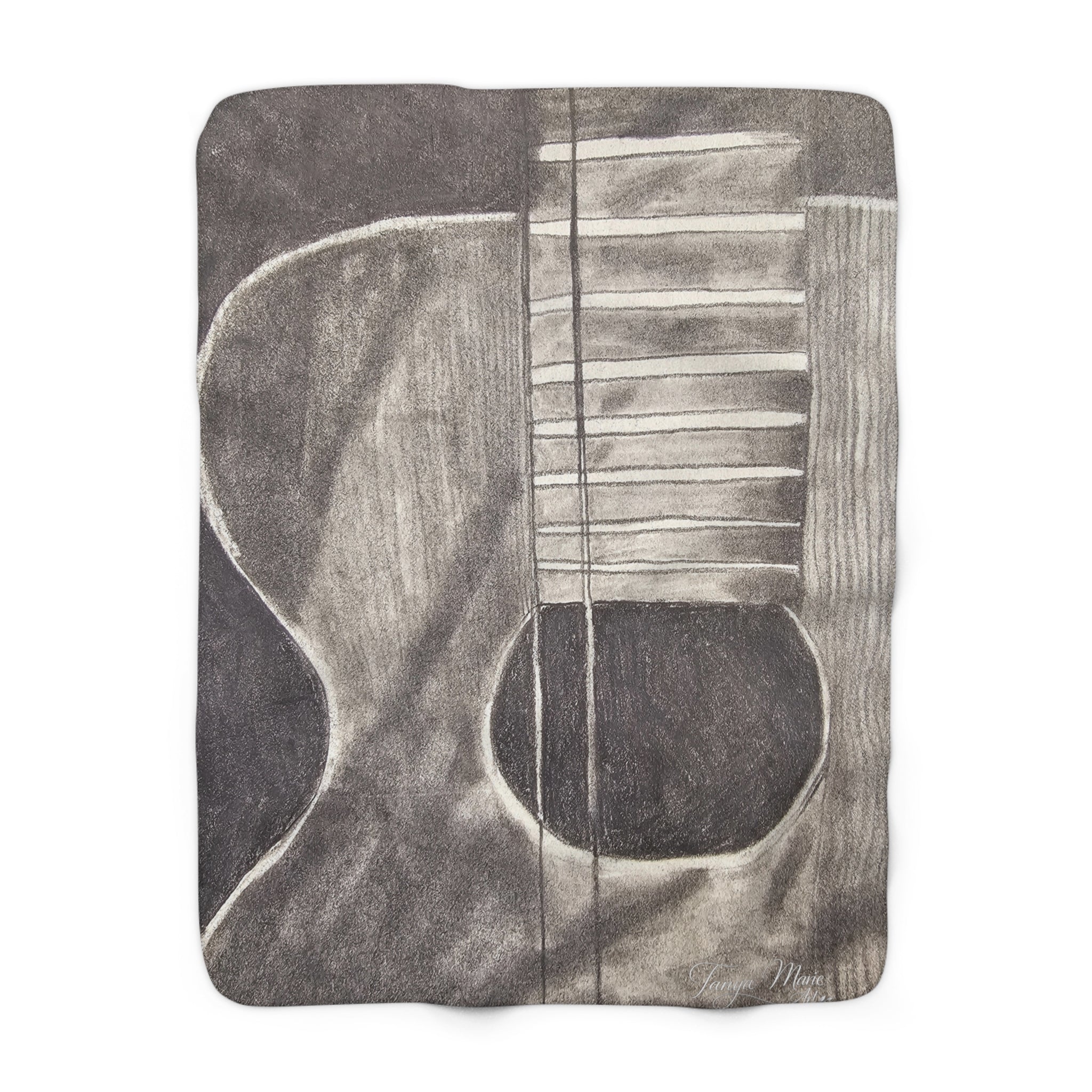 Sherpa-style blanket close-up showing gray acoustic guitar lines and dark bottom edge