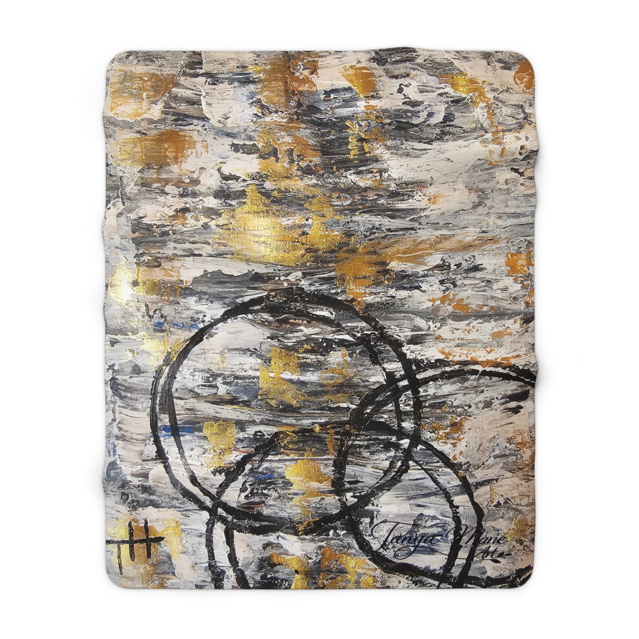 Rectangular sherpa blanket with abstract gold, gray, and charcoal circular line artwork