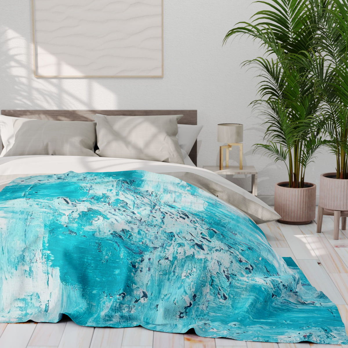 Turquoise abstract fleece blanket on bed, spread across duvet with splash pattern