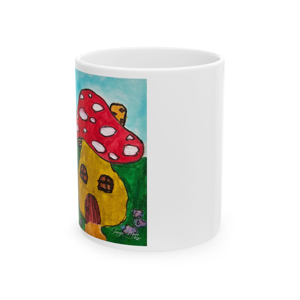 White ceramic mug with side view of red mushroom house illustration