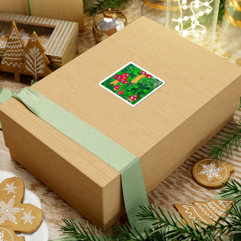 Square kiss-cut sticker with green frog and red toadstools on gift box