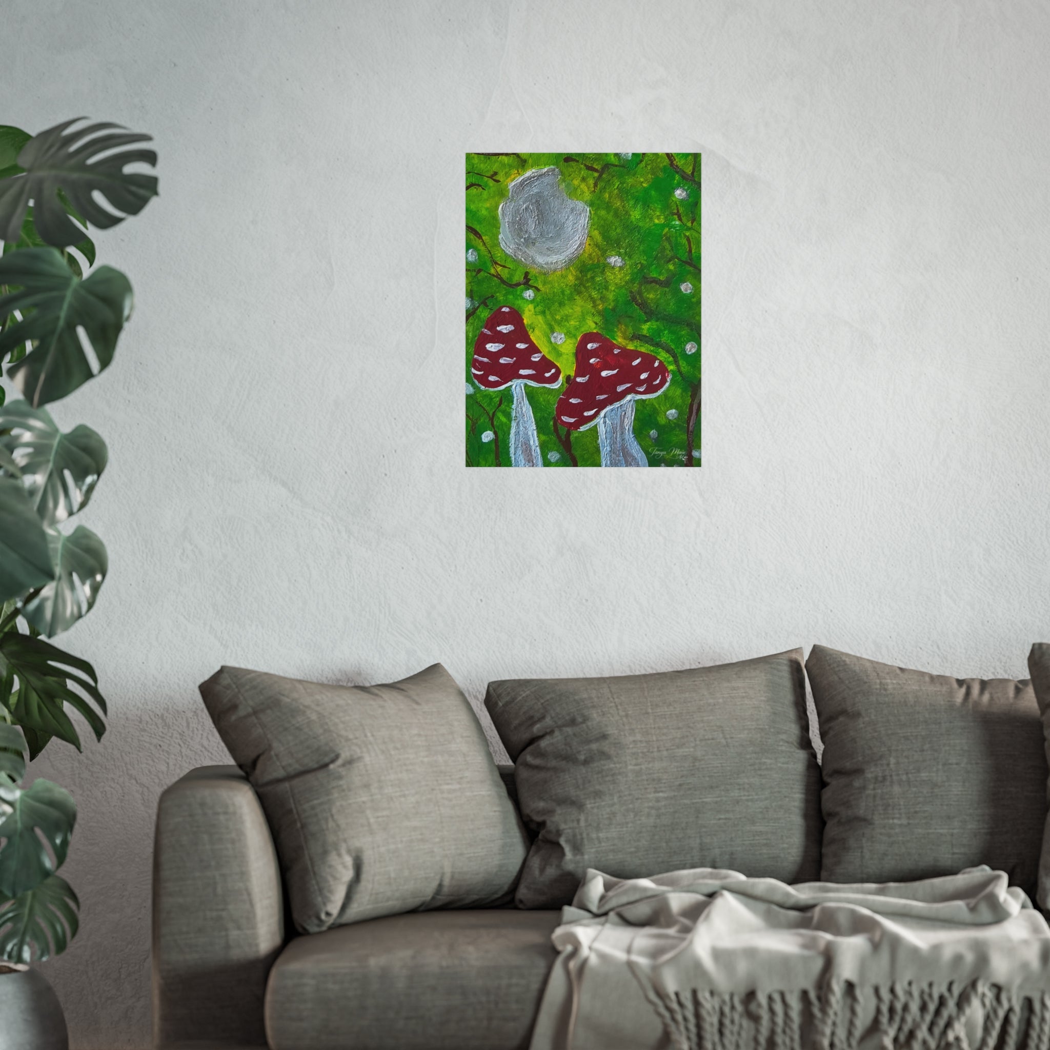 Small framed-style mushroom wall art poster on a wall: green forest, gray cap, red spotted mushrooms.