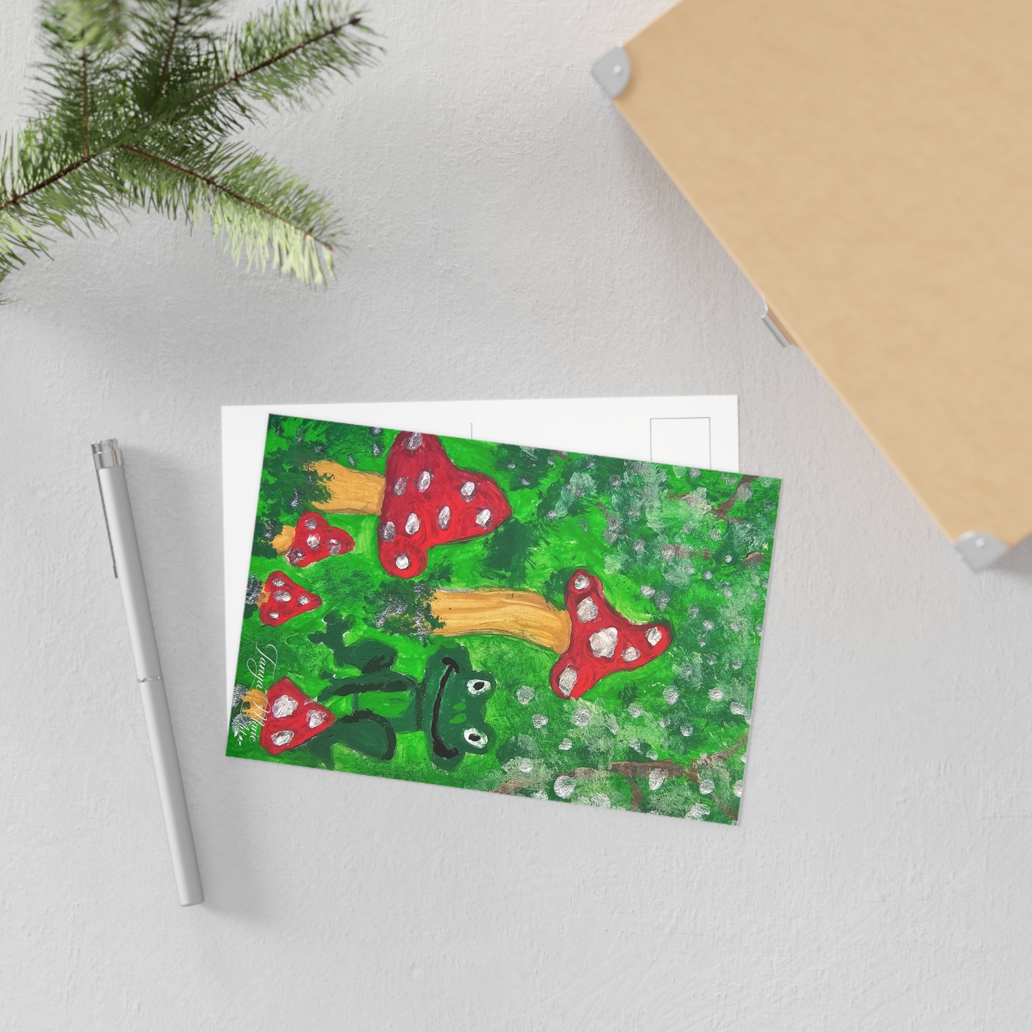 Whimsical frog and red toadstools art postcard front on white backing cards