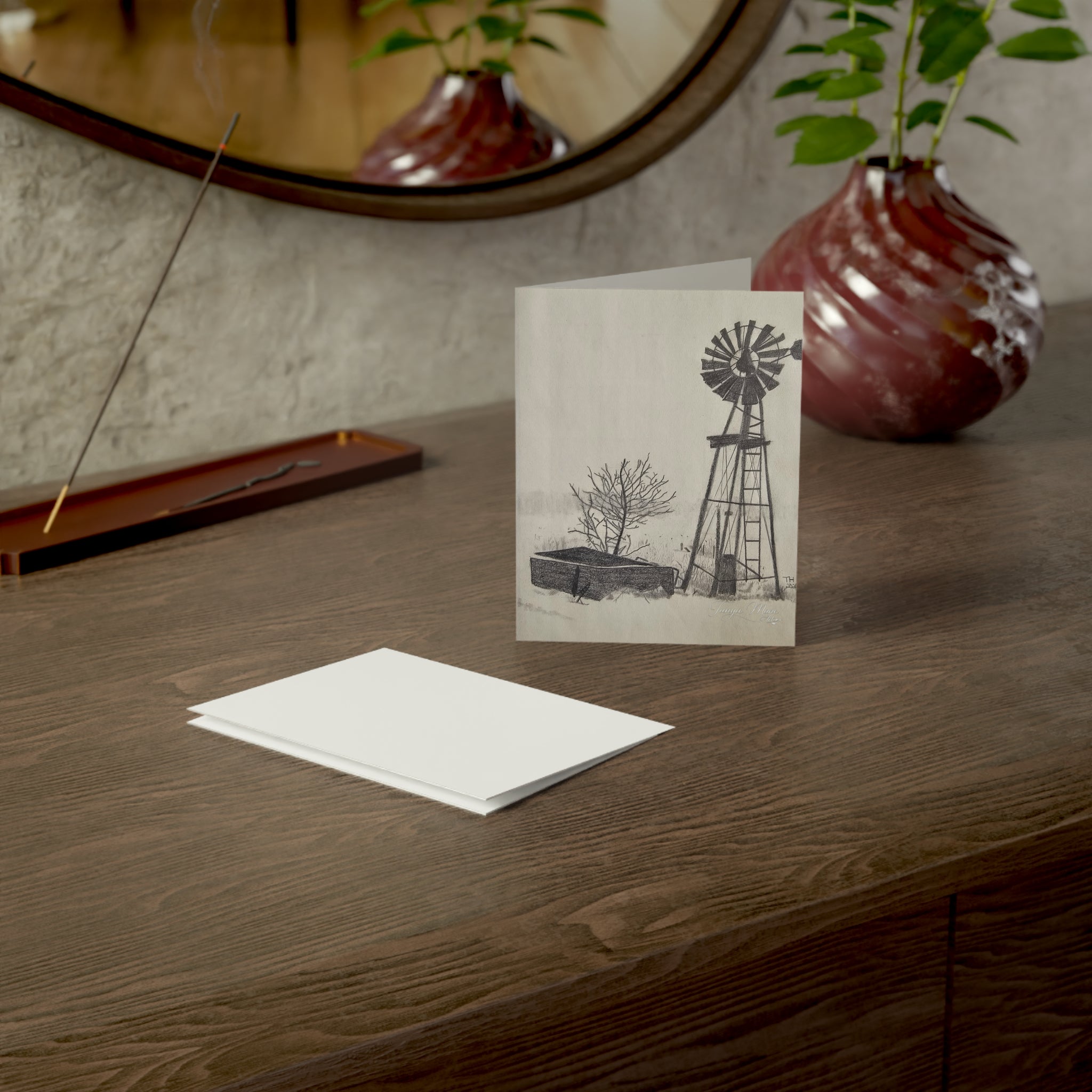 White greeting card front with windmill and farmhouse landscape sketch, rectangular