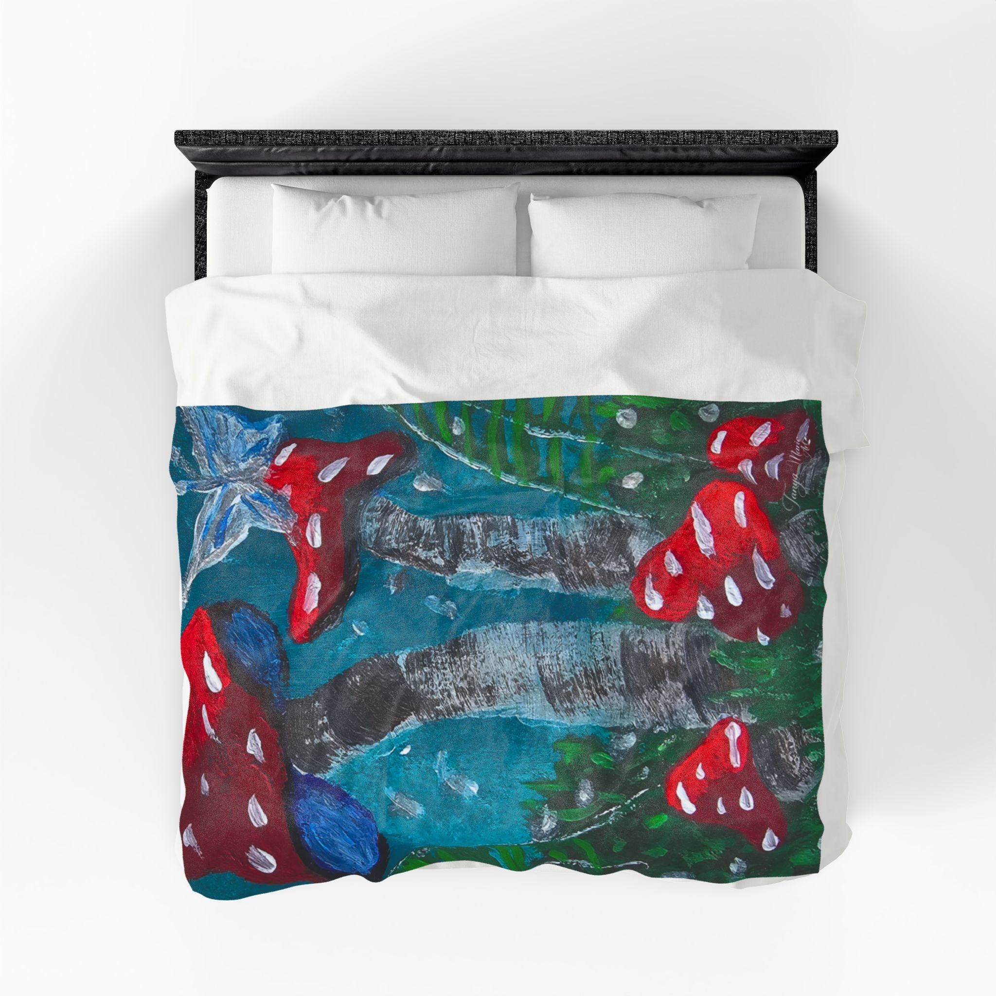 Velveteen plush throw blanket on white bedding, mushroom scene with teal, green, and red caps