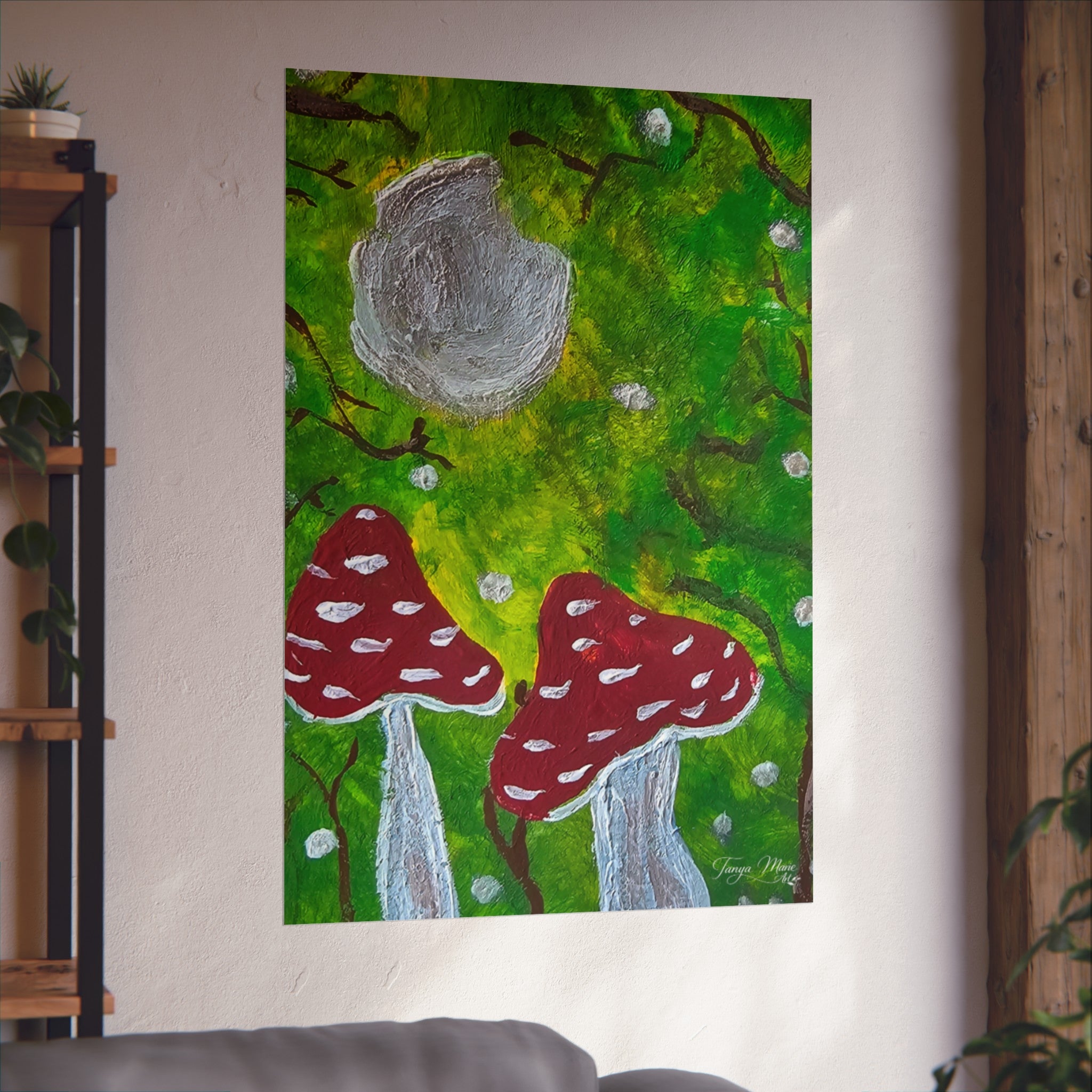 Square poster showing gray moon over green forest with two red polka-dot mushrooms.