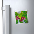 Hand-painted toadstool art magnet with red mushrooms under a gray moon on a fridge
