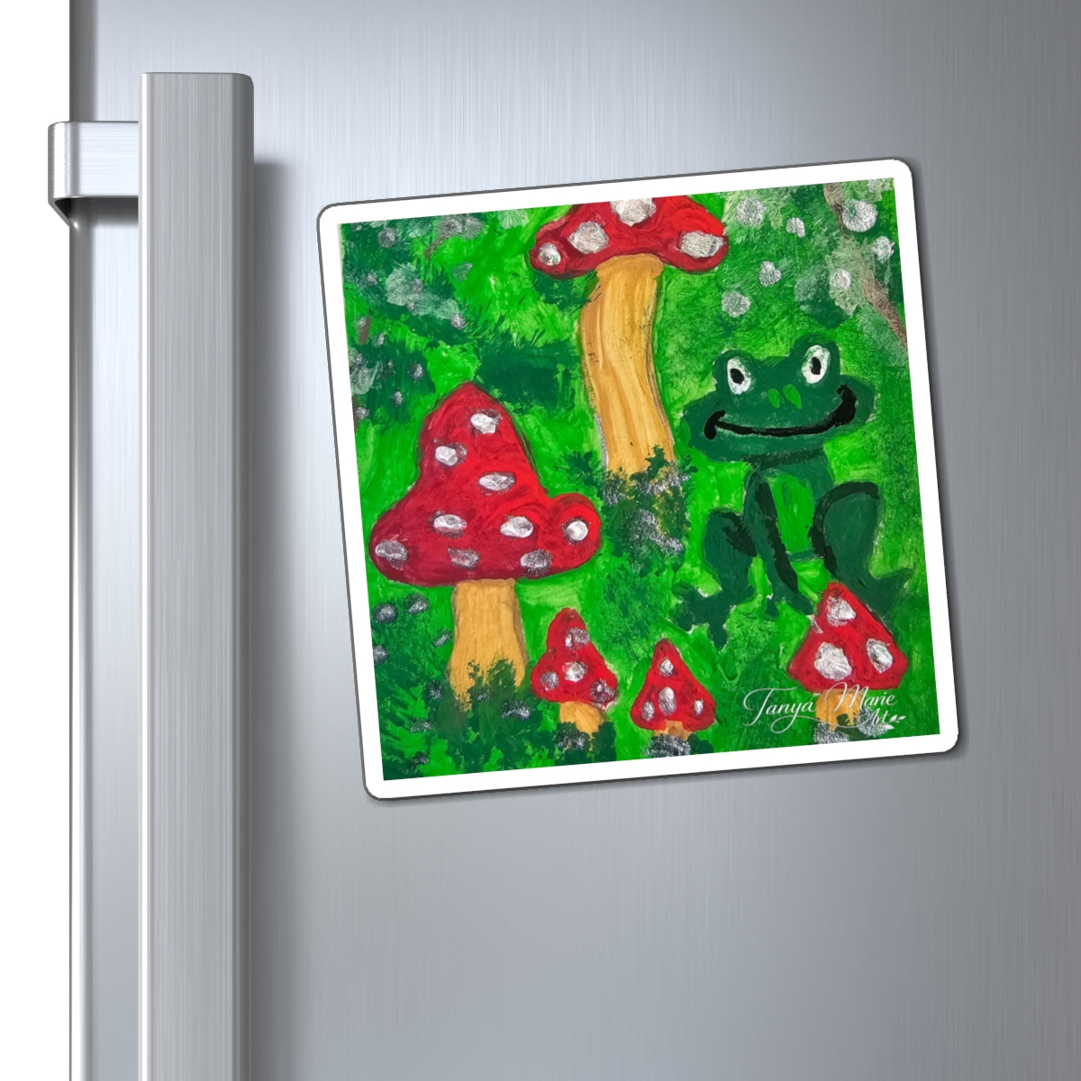 Rectangular refrigerator magnet with green frog, red mushrooms, and white border