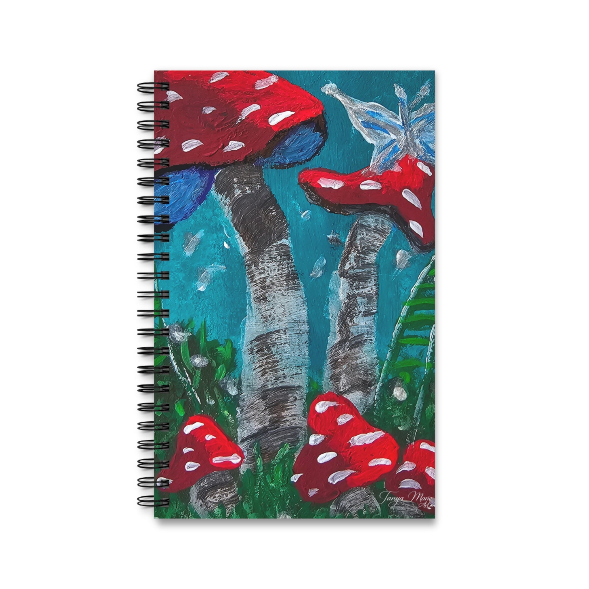 Spiral journal cover with red toadstools, misty forest scene, and bird illustration at top.