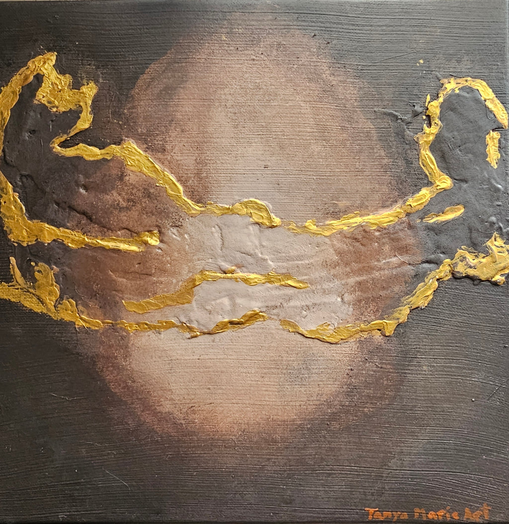 Close-up textured abstract canvas with gold wavy edges over brown-gray surface