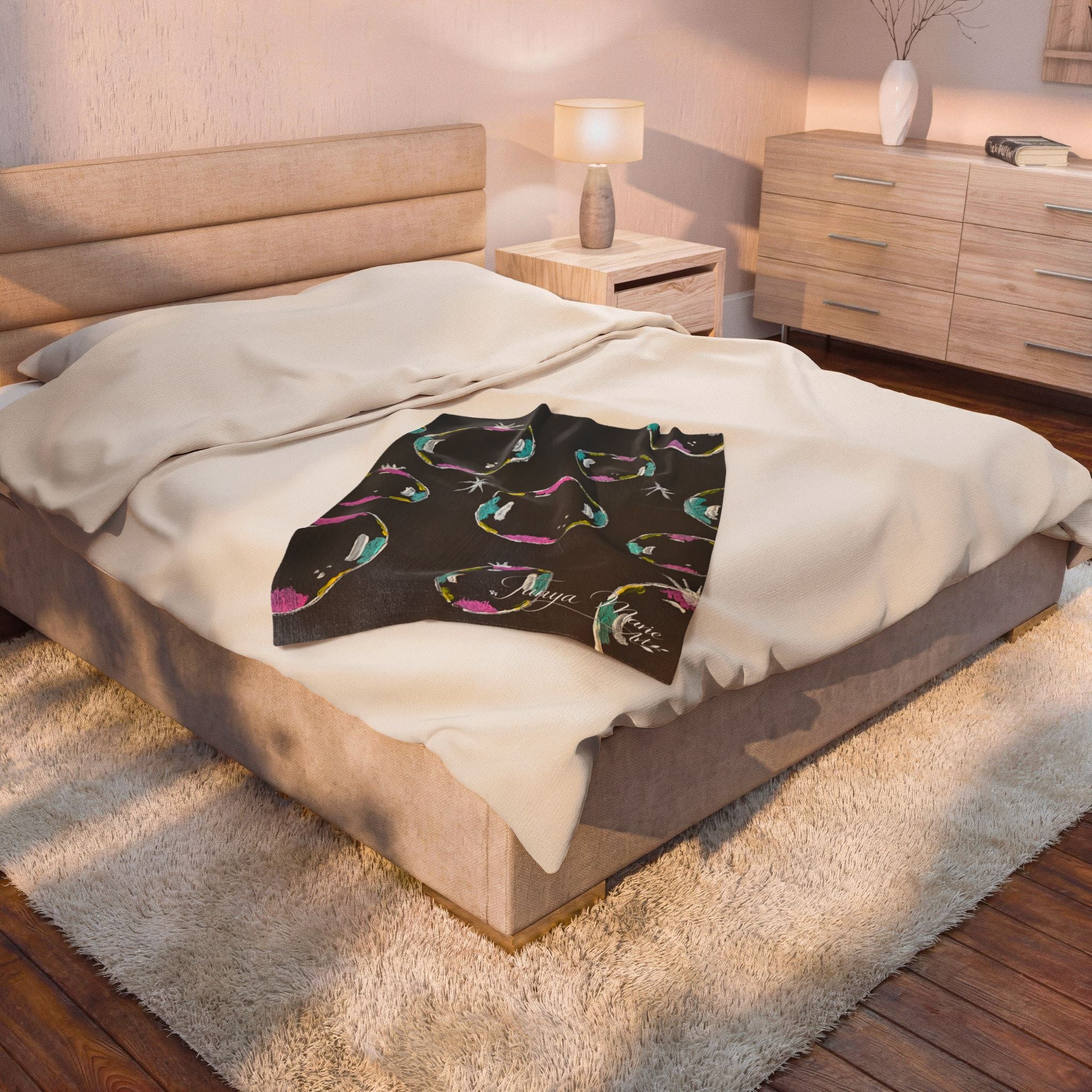 Plush blanket throw with dark background and colorful bubble circle pattern
