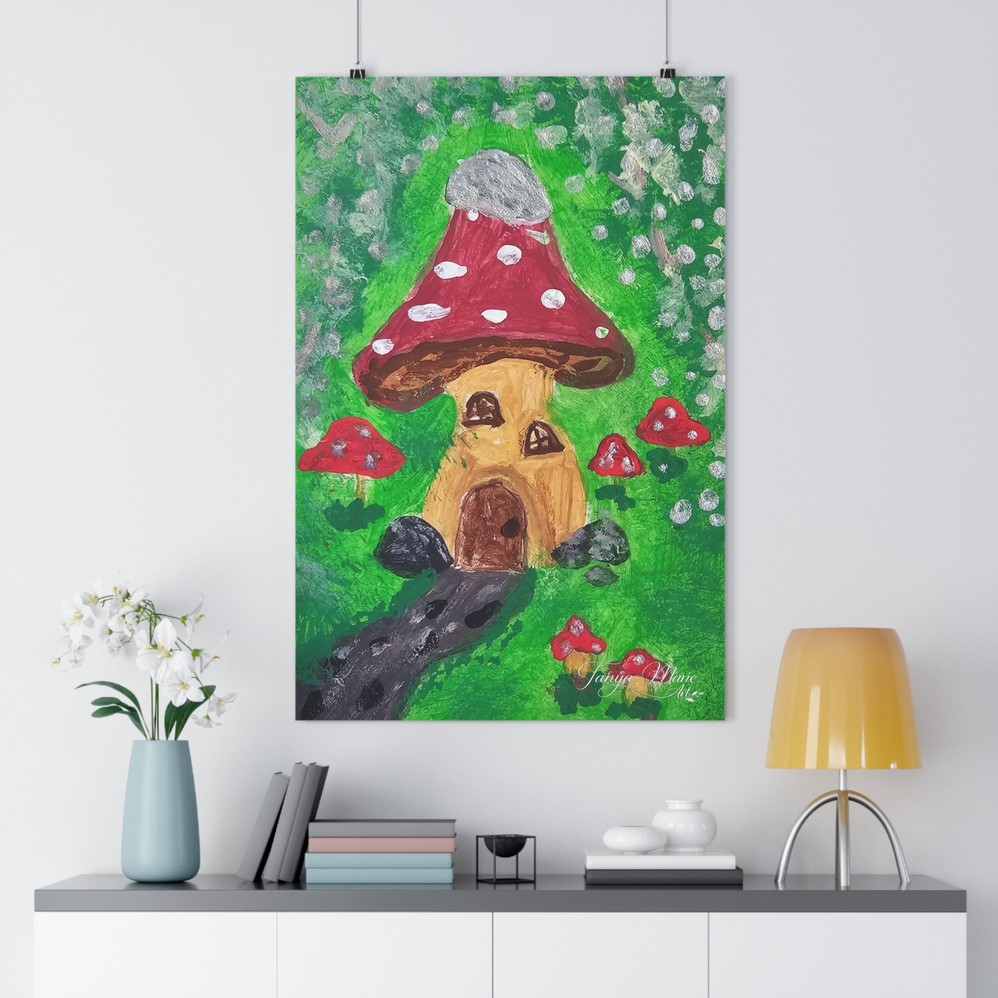 Fairy garden wall art print with red spotted mushroom and brown door amid green leaves